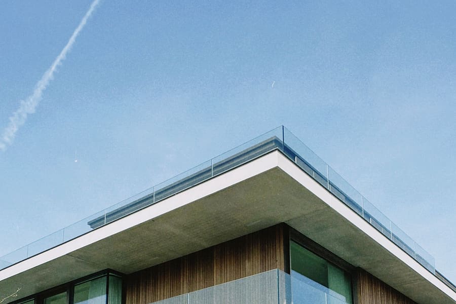 Modern villa balcony enclosed with a frameless toughened glass railing