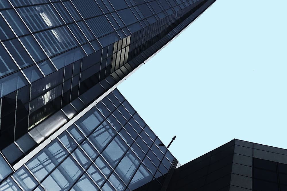 Commercial building clad in a structural glass and aluminium facade